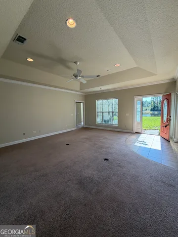 an empty room with a empty space and windows