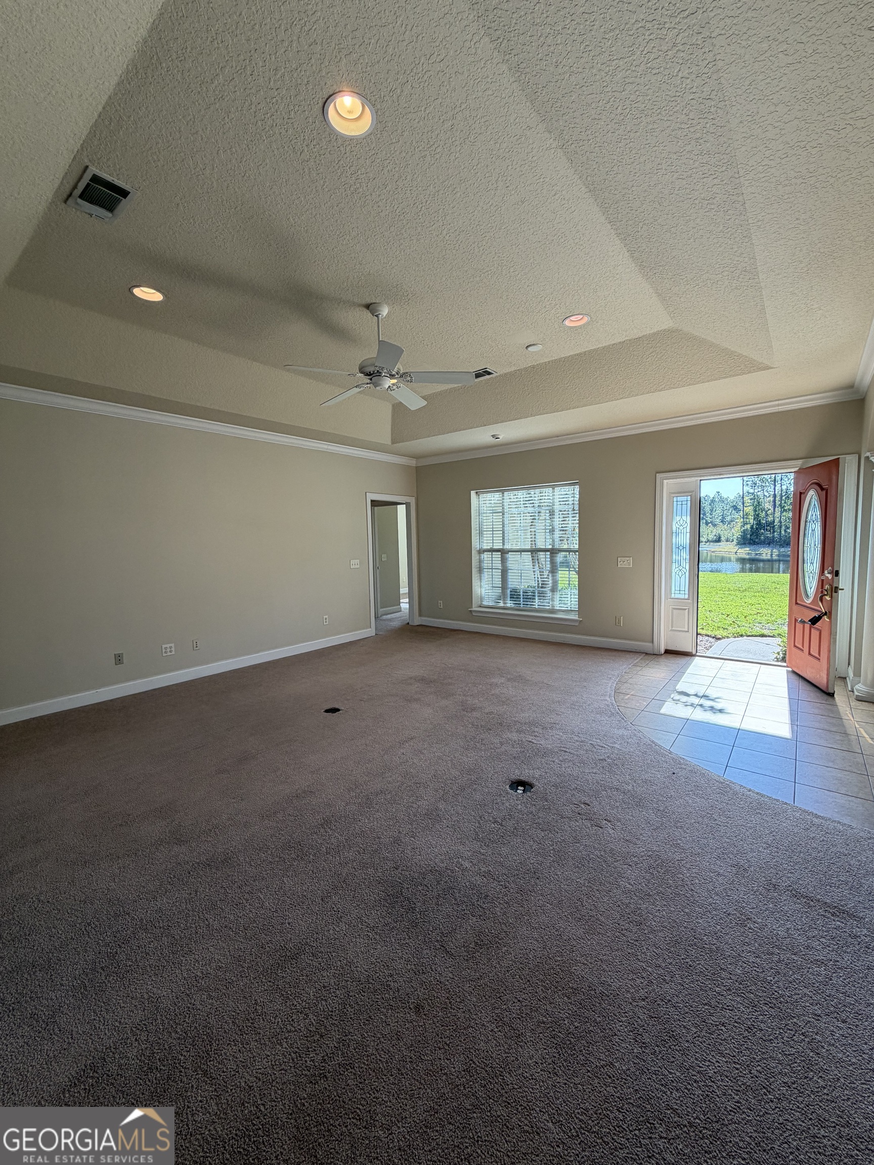 36 Coastal Walk St. Marys, GA 31558 - Photo 6 of 40 an empty room with a empty space and windows