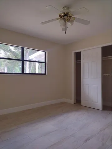 an empty room with fan