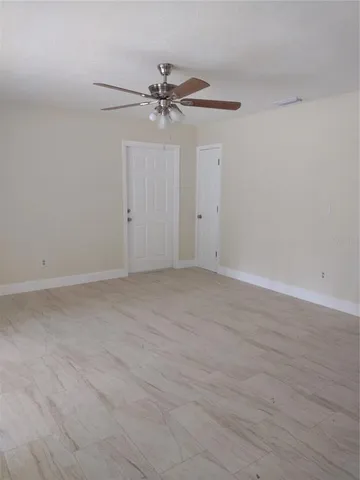 a white toilet sitting next to a bath tub
