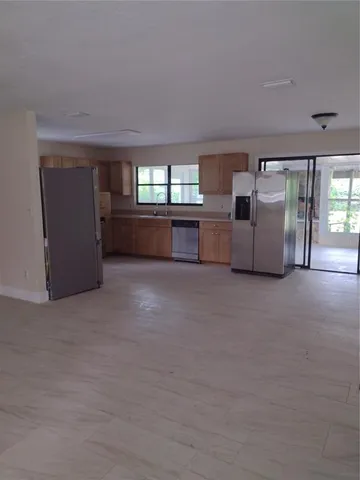 a view of a livingroom with furniture and windows