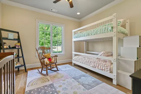 a en suite bathroom with a double vanity sink and a mirror