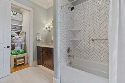 a bathroom with a bathtub and shower