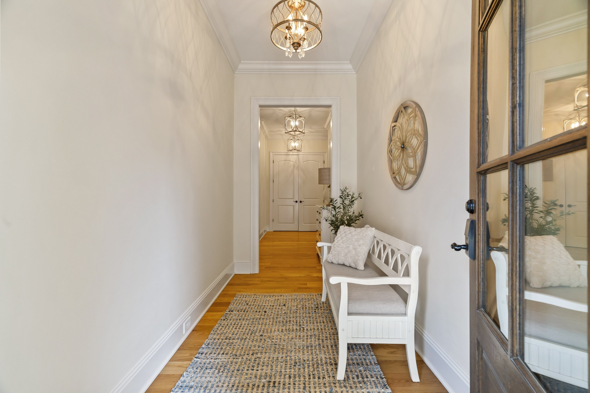 8127 Mountaintop Drive College Grove, TN 37046 - Photo 52 of 72 a hallway with painting on the wall and a window