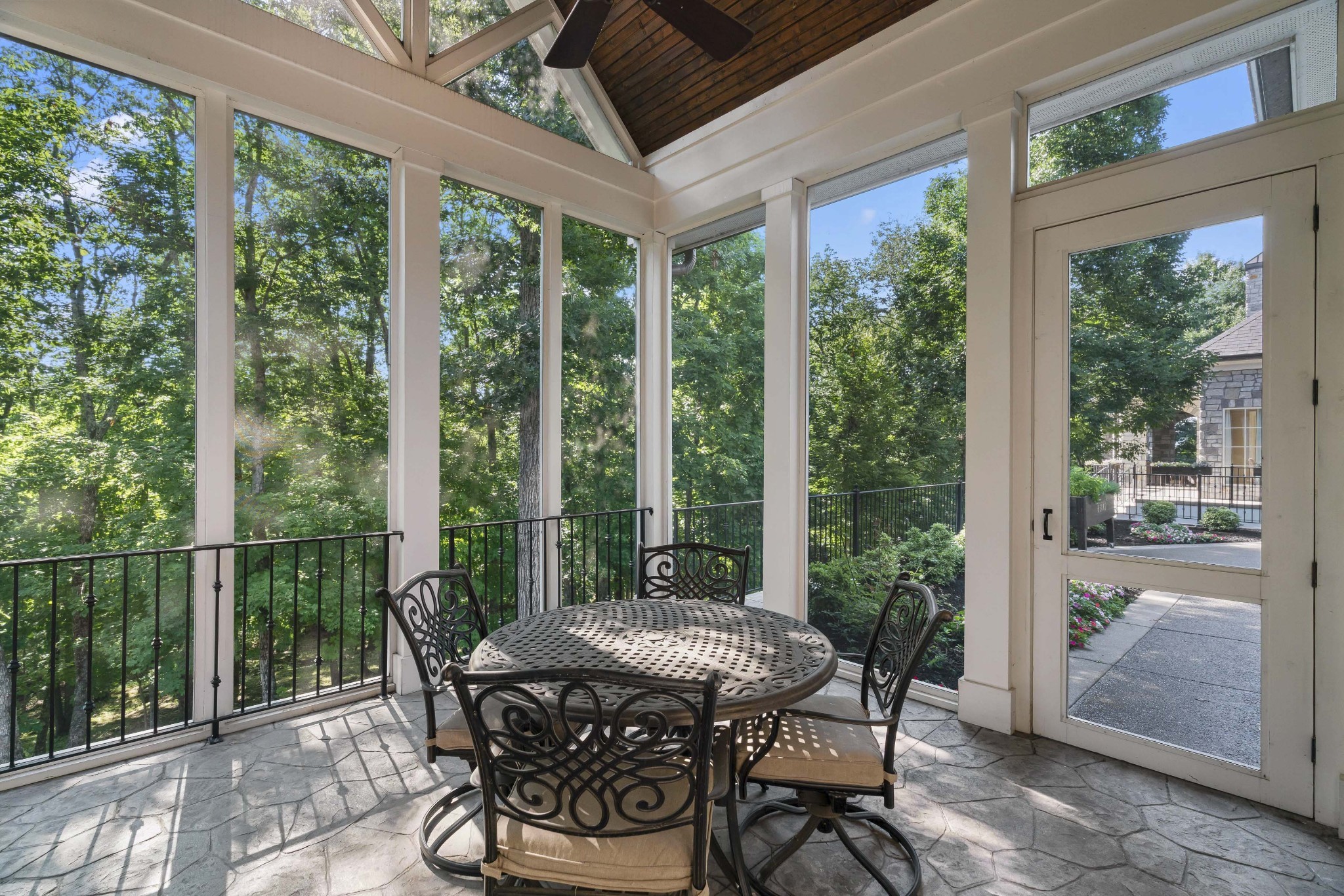 8127 Mountaintop Drive College Grove, TN 37046 - Photo 59 of 72 a view of a patio with a table chairs and a porch