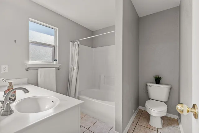 a bathroom with a toilet sink and bathtub