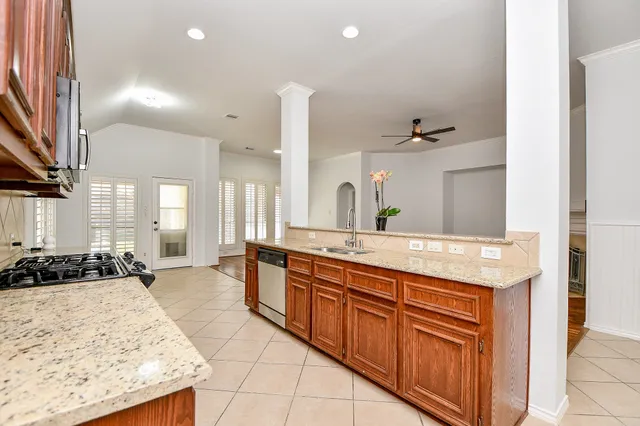 a spacious bathroom with a double vanity sink a mirror and a bathtub