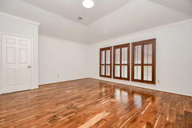 a bathroom with a sink a toilet and a large mirror