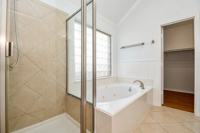 a picture of a bathroom with a shower
