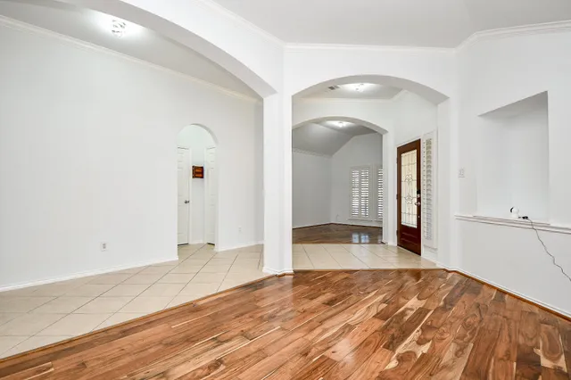 a large kitchen with stainless steel appliances granite countertop a stove a sink and a microwave