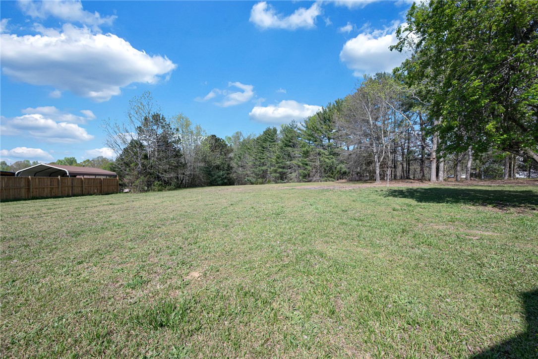 220 Bill Kay Road Belton, SC 29627 - Photo 29 of 30 Expansive green yard offering endless possibilities for outdoor enjoyment and future development.