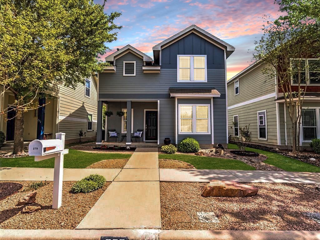 279 Cleveland Kyle, TX 78640 - Photo 1 of 1 a view of house in front of a yard with potted plants