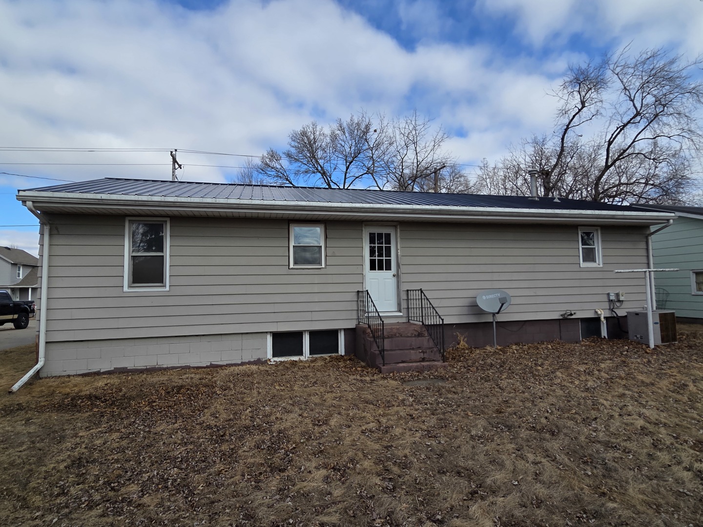 1419 5th Street Camanche, IA 52730 - Photo 2 of 14 a view of a house with a backyard