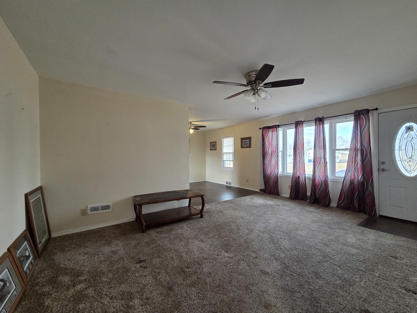 1419 5th Street Camanche, IA 52730 - Photo 3 of 14 a view of a livingroom with furniture and a ceiling fan