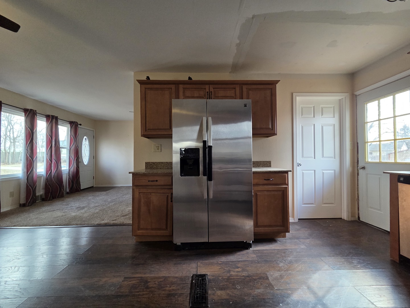 1419 5th Street Camanche, IA 52730 - Photo 7 of 14 a kitchen with stainless steel appliances granite countertop a refrigerator and a sink
