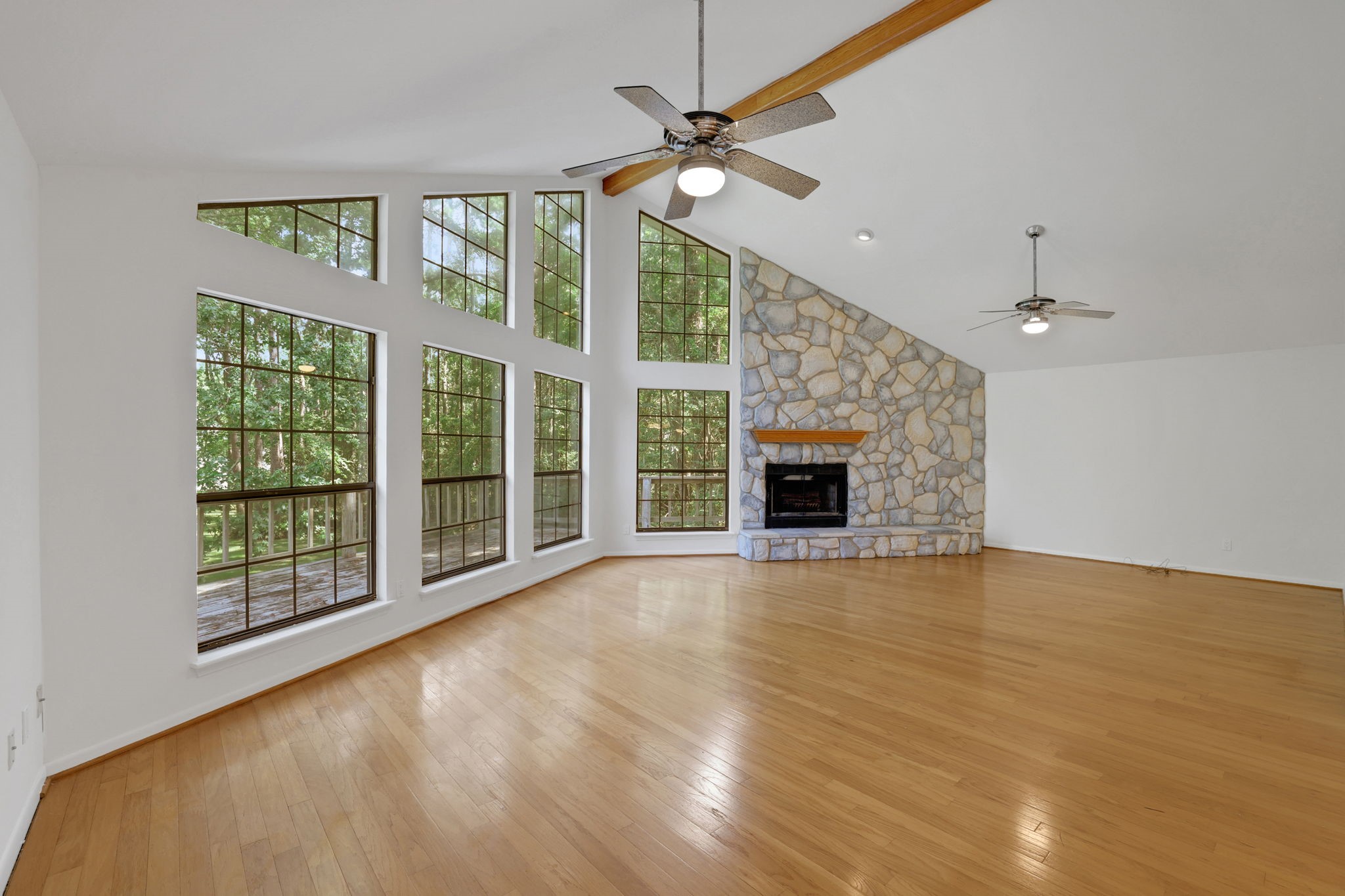 200 Johnson Road Coldspring, TX 77331 - Photo 10 of 47 The main living area is upstairs and this wall of windows brings in tons of natural light