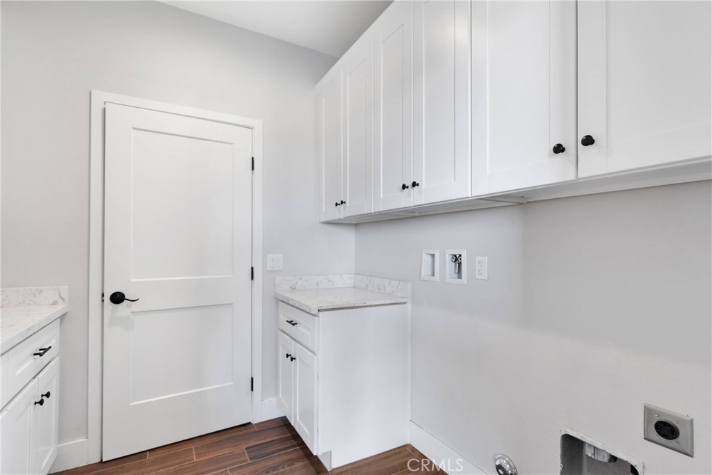 10055 Eaby Road Phelan, CA 92371 - Photo 13 of 19 a view of cabinets and wooden floor