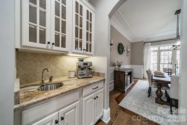 a kitchen with a sink and cabinets