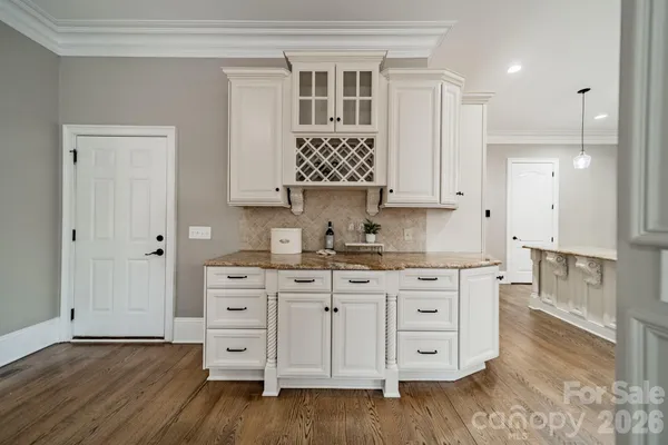 a kitchen with stainless steel appliances granite countertop a sink and cabinets