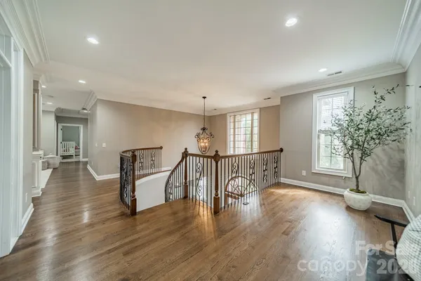 a view of an entryway with wooden floor