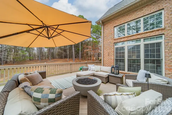 a balcony with furniture and outdoor view