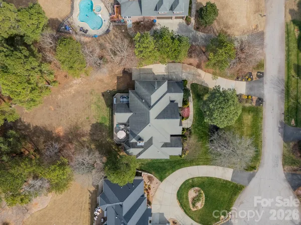 an aerial view of a house with outdoor space