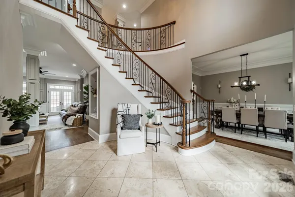 a living room with lots of furniture and white walls