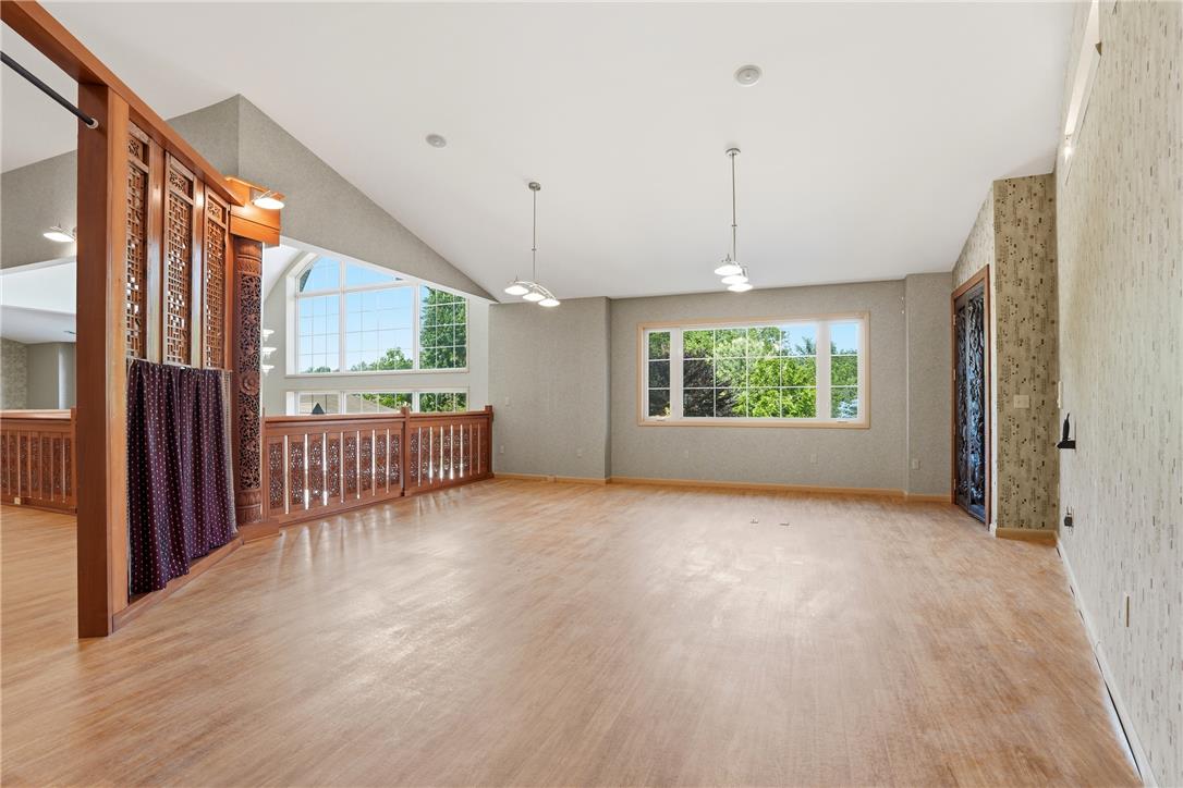 6271 Batman Road Zionsville, PA 18092 - Photo 66 of 100 A spacious and inviting living area features elevated ceilings and plentiful natural light from multiple large windows.