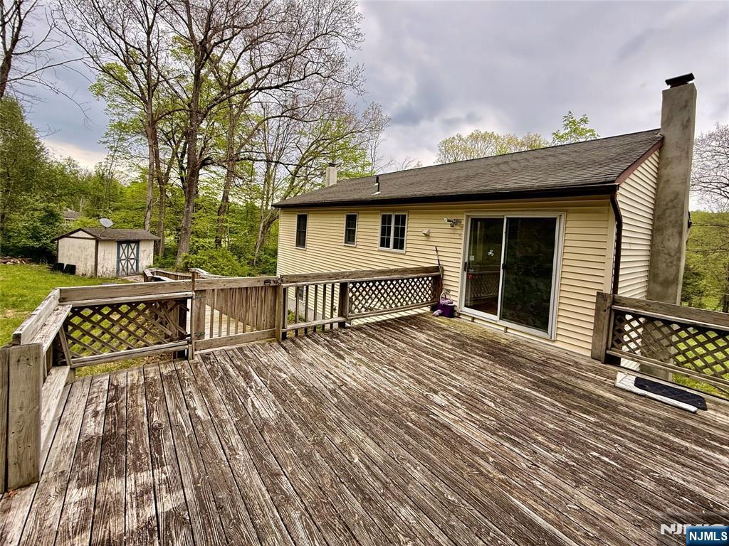 154 Cork Hill Road Franklin, NJ 07416 - Photo 33 of 35 a view of a house with wooden deck front of house