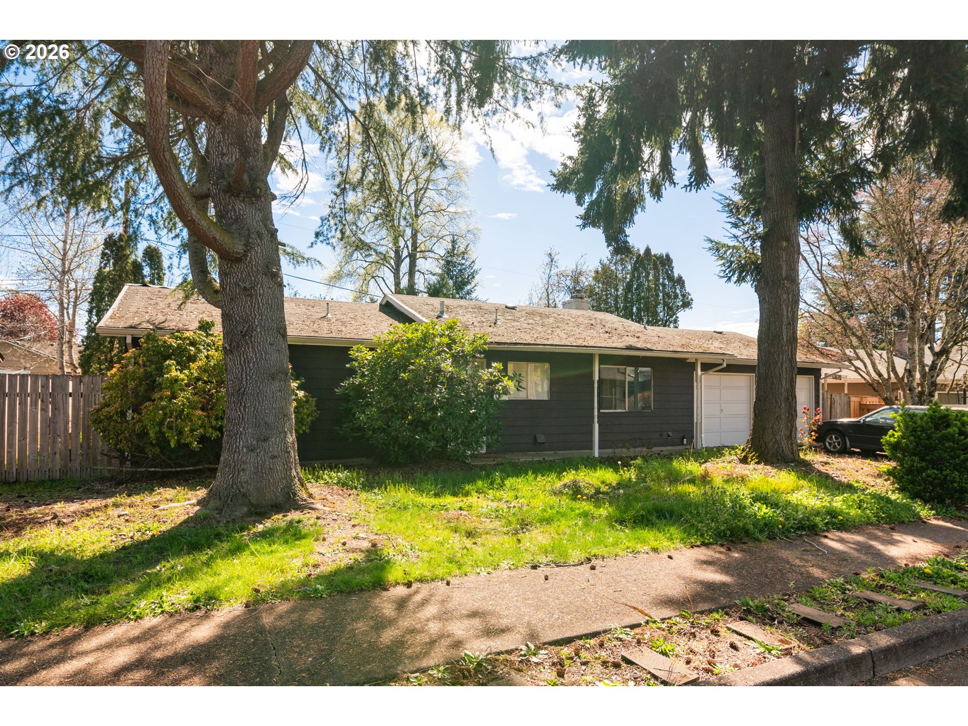 13670 Southwest 21st Street Beaverton, OR 97008 - Photo 2 of 26 a front view of a house with a yard and a garden