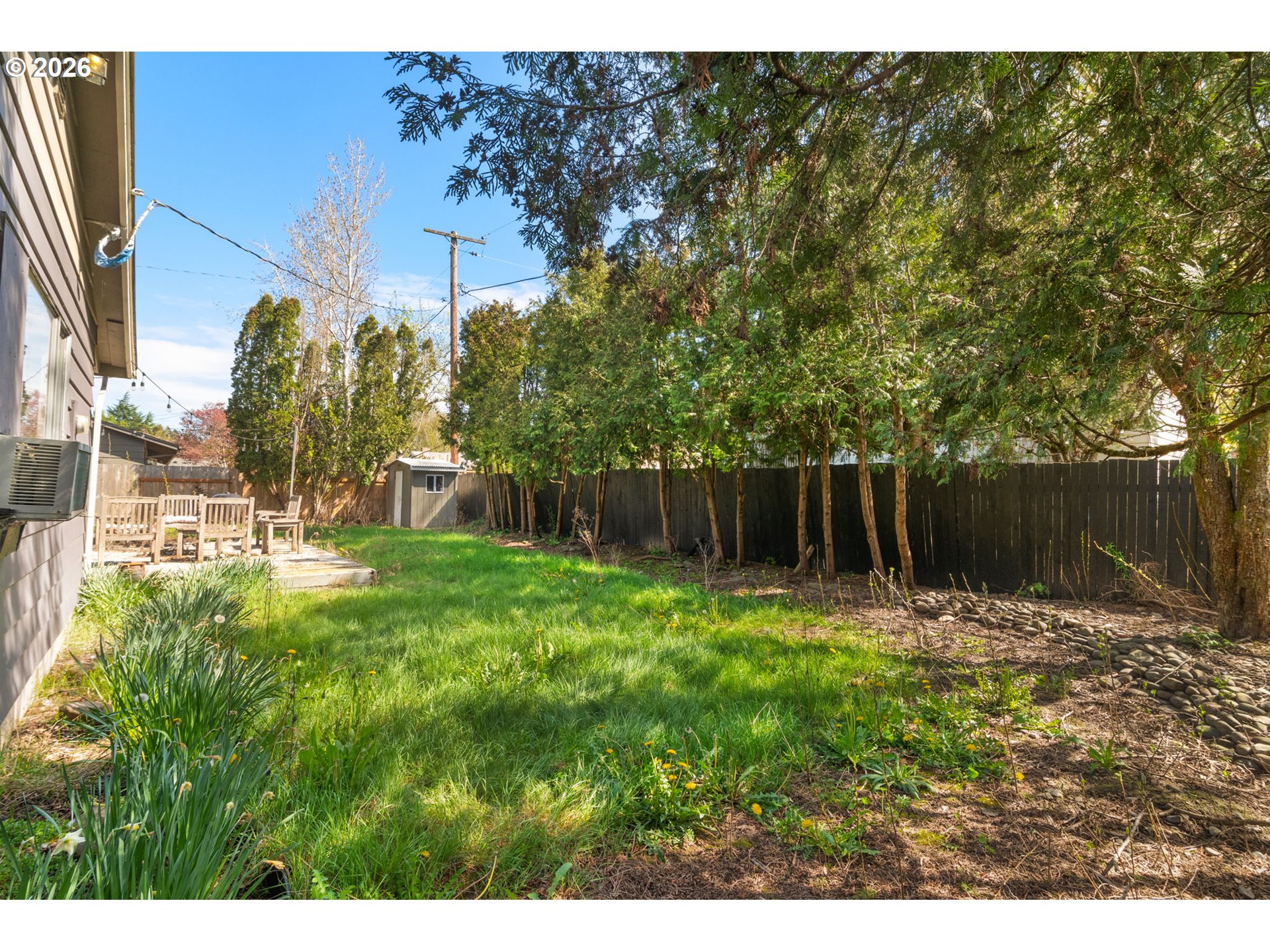 13670 Southwest 21st Street Beaverton, OR 97008 - Photo 21 of 26 a backyard of a house with lots of green space