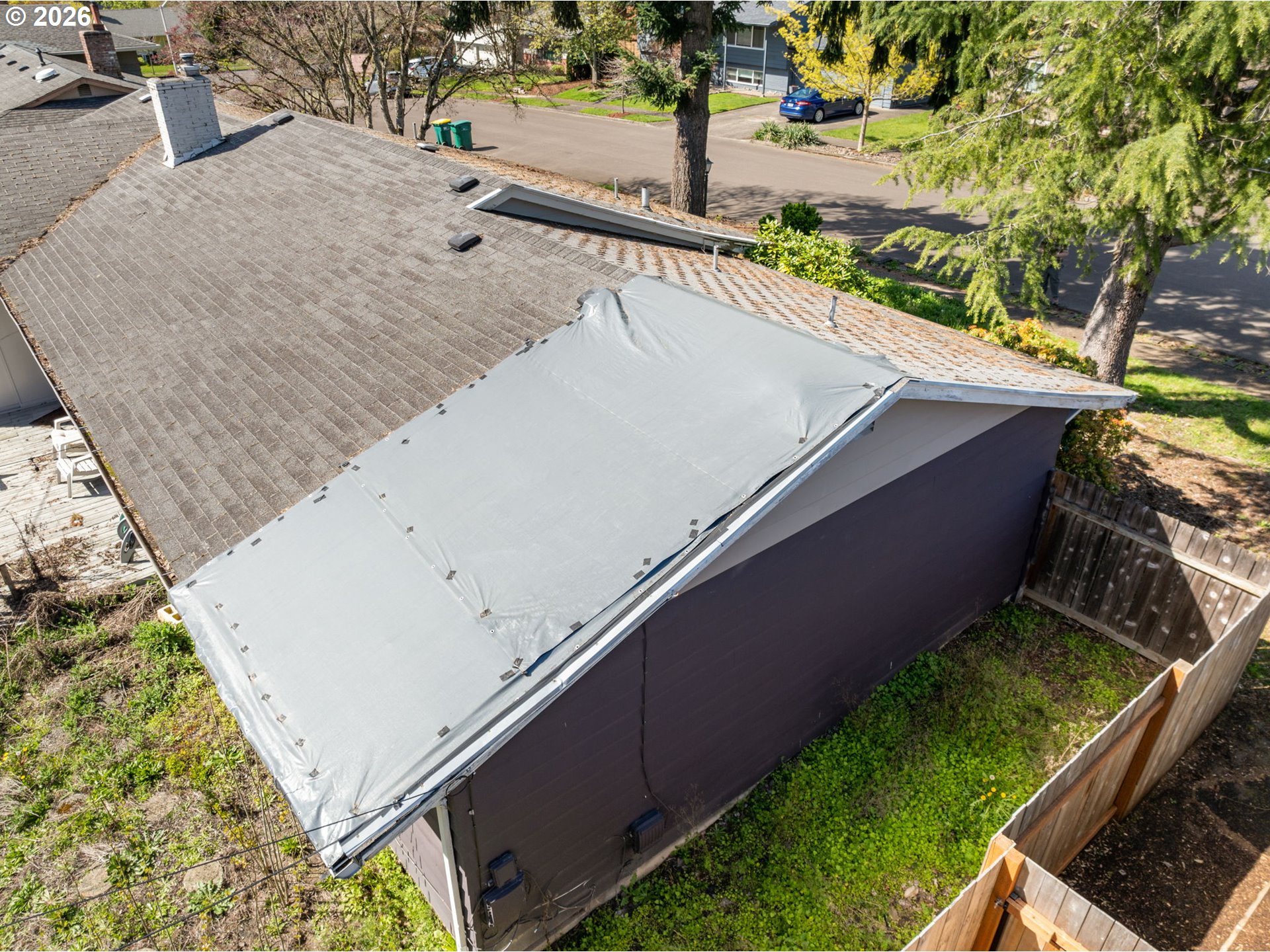 13670 Southwest 21st Street Beaverton, OR 97008 - Photo 23 of 26 a view of a backyard and floor to ceiling window and wooden fence