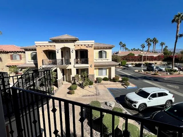 front view of a building with a garden