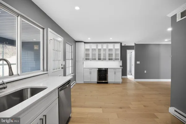 a kitchen with granite countertop a stove and cabinets