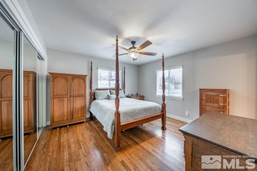 1640 Davidson Way Reno, NV 89509 - Photo 10 of 25 a bedroom with a bed and wooden floor