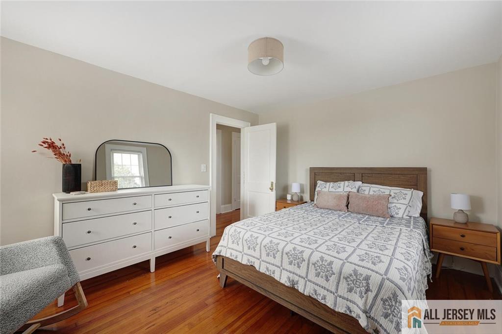 23 Edgegrove Street Edison, NJ 08837 - Photo 15 of 34 a bedroom with a bed and a dresser