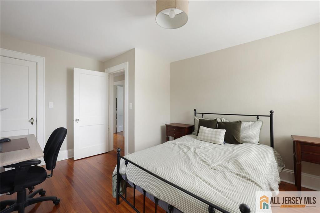 23 Edgegrove Street Edison, NJ 08837 - Photo 18 of 34 a bedroom with a bed and a desk next to a window