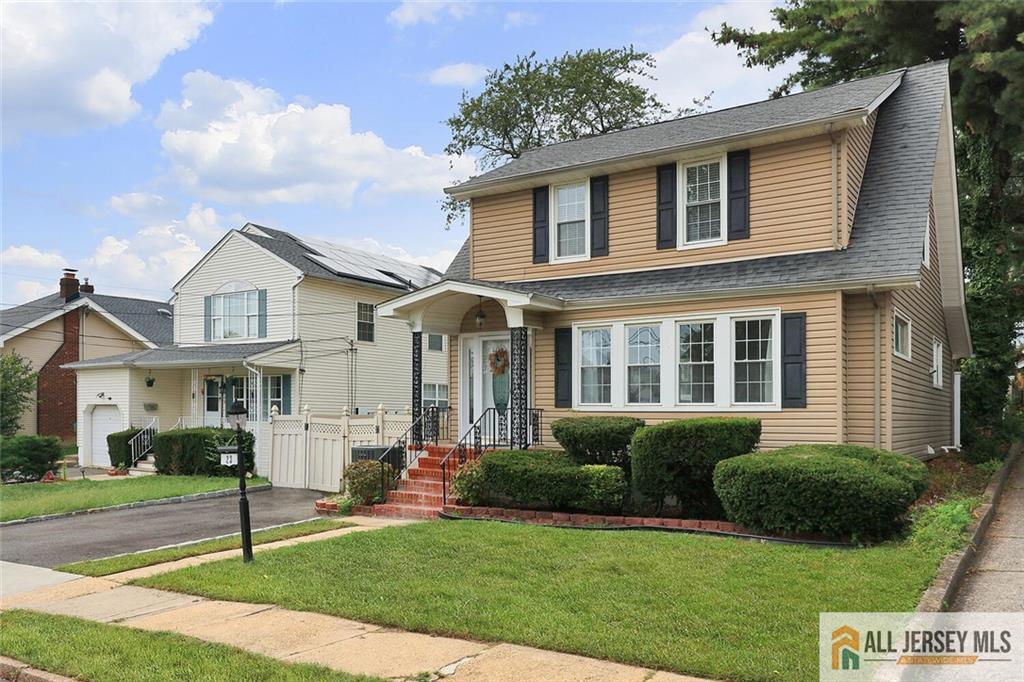 23 Edgegrove Street Edison, NJ 08837 - Photo 2 of 34 a front view of a house with a yard