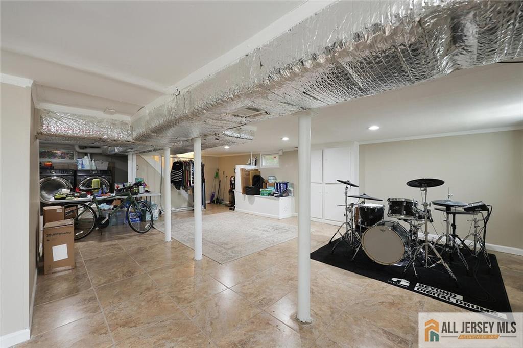 23 Edgegrove Street Edison, NJ 08837 - Photo 23 of 34 a lobby with furniture and a glass door