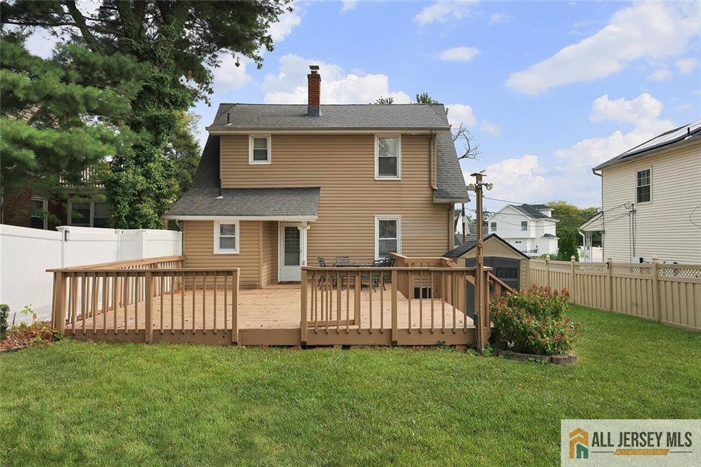 23 Edgegrove Street Edison, NJ 08837 - Photo 29 of 34 a view of a house with a yard and deck