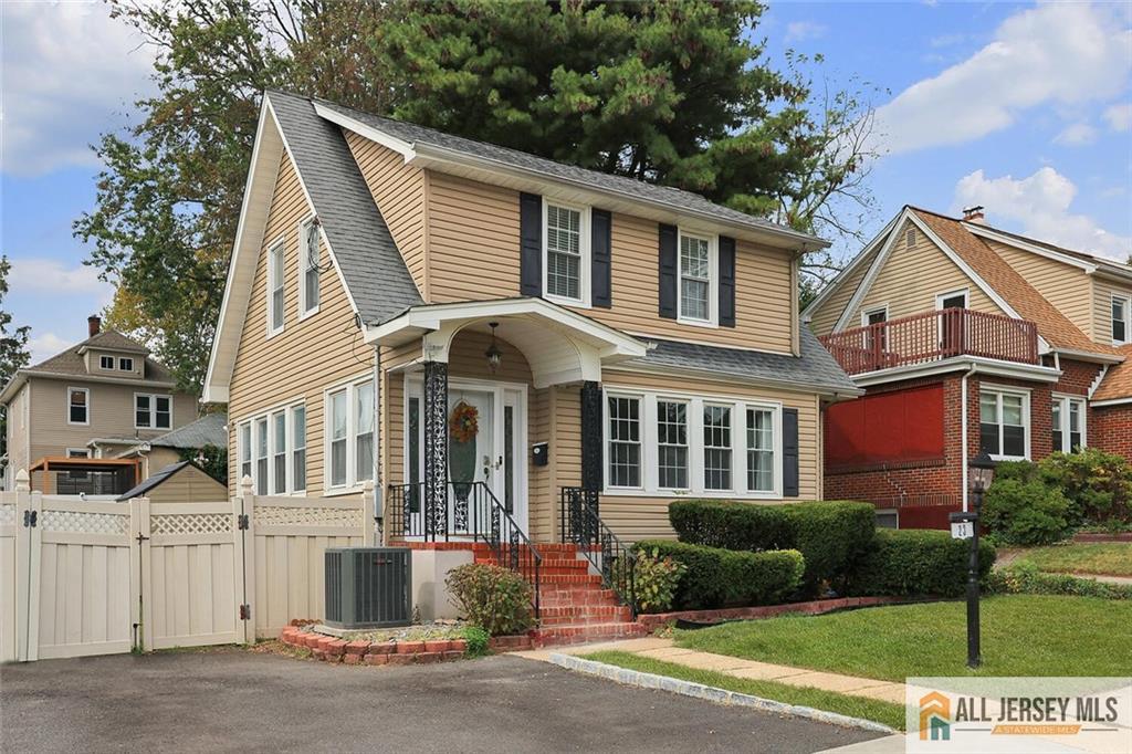 23 Edgegrove Street Edison, NJ 08837 - Photo 3 of 34 a front view of a house with a yard