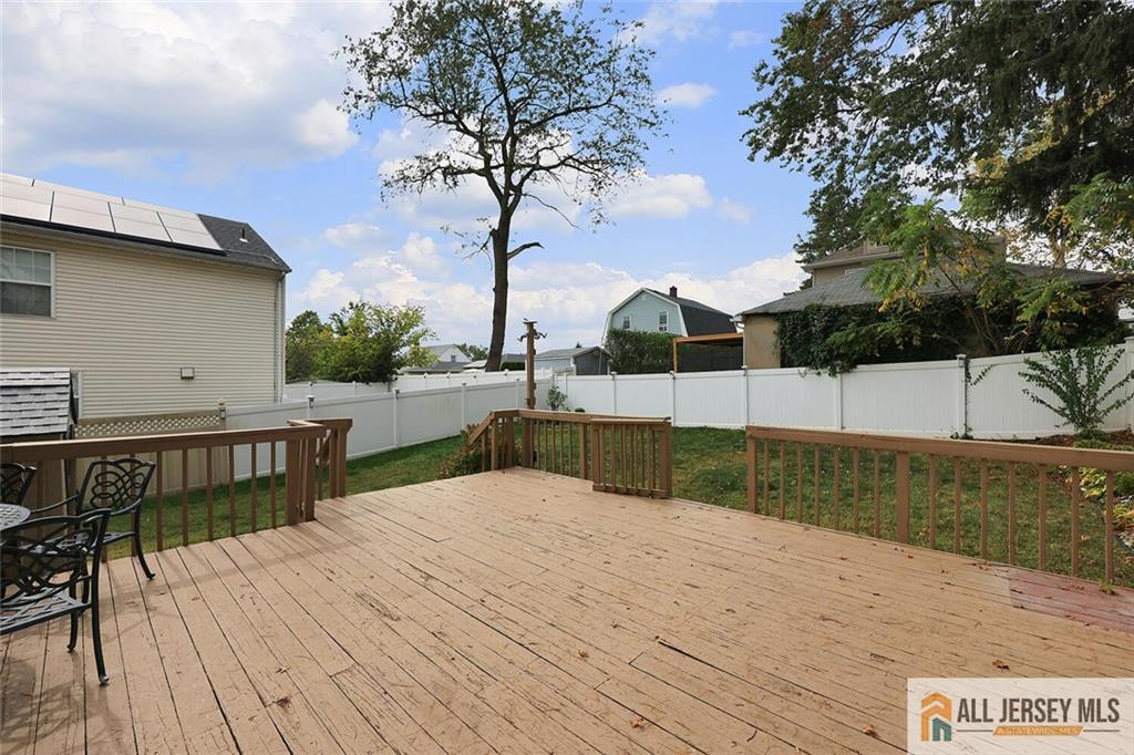 23 Edgegrove Street Edison, NJ 08837 - Photo 33 of 34 a view of backyard with swimming pool and seating space