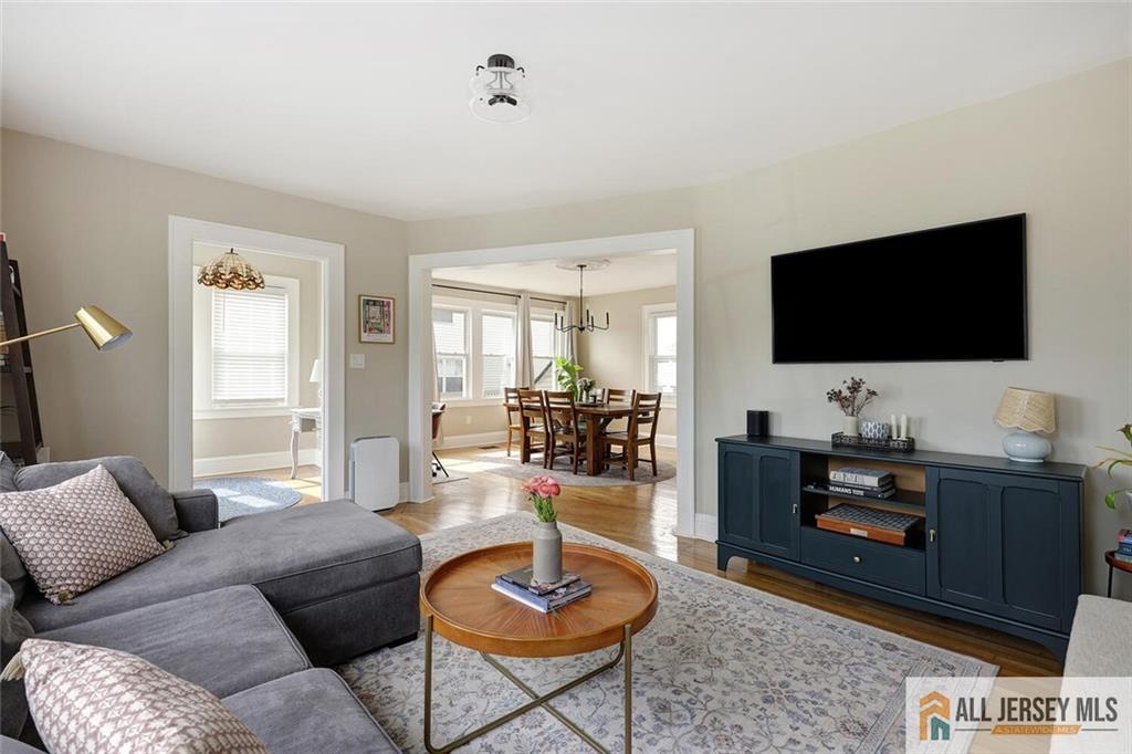 23 Edgegrove Street Edison, NJ 08837 - Photo 8 of 34 a living room with furniture and a flat screen tv