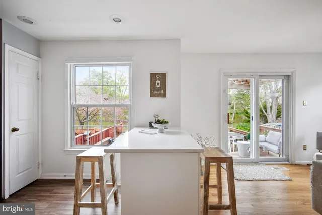 a room with a table and chairs in it