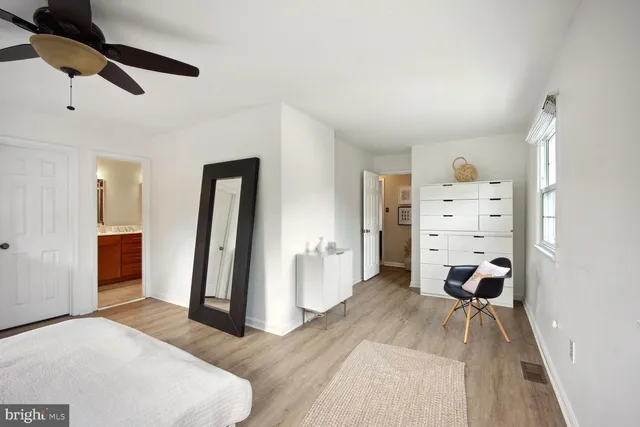 a bedroom with furniture and a chandelier