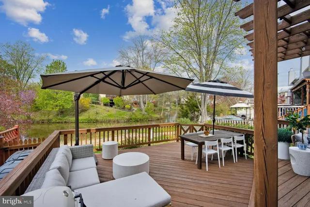 a view of a chair and tables in the balcony