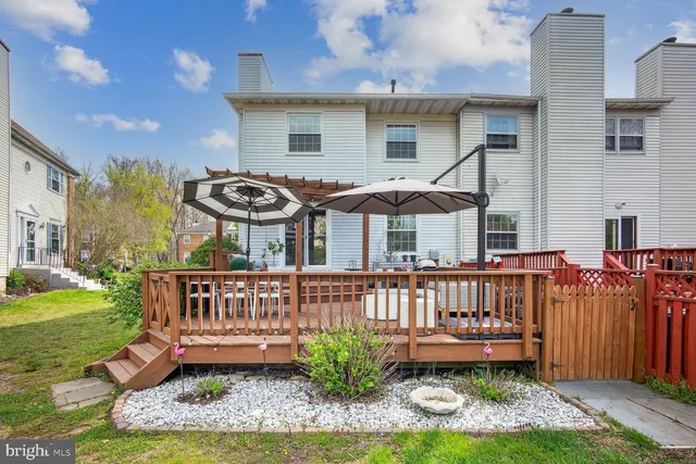a front view of a house with a garden and plants