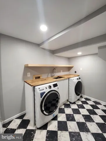 a view of a storage & utility room with a washer and dryer