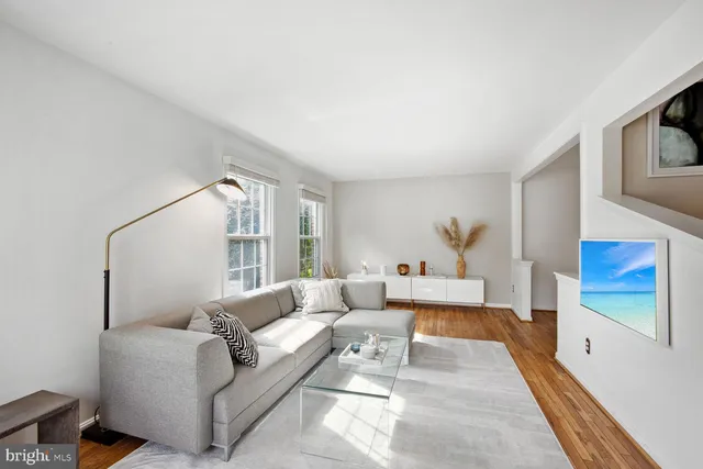 a living room with furniture and a rug