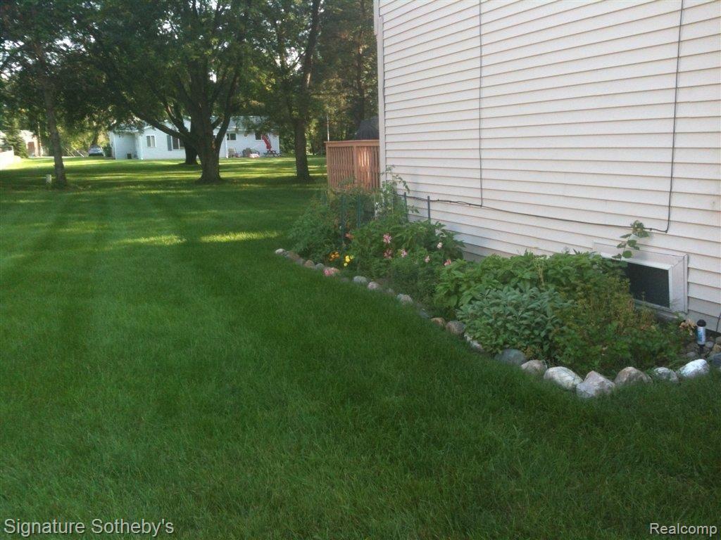 8735 22 Mile Road, Unit 13 Utica, MI 48317 - Photo 14 of 14 Side Yard.JPG